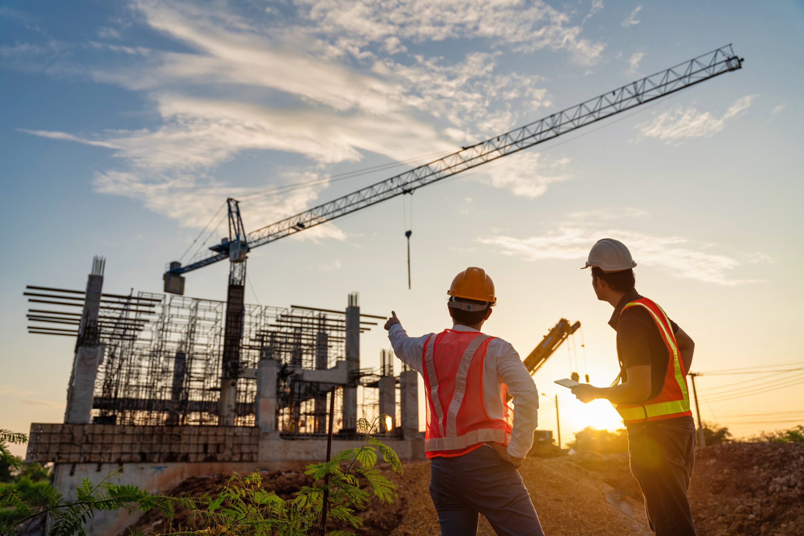 Asian two business man construction engineers supervising progre